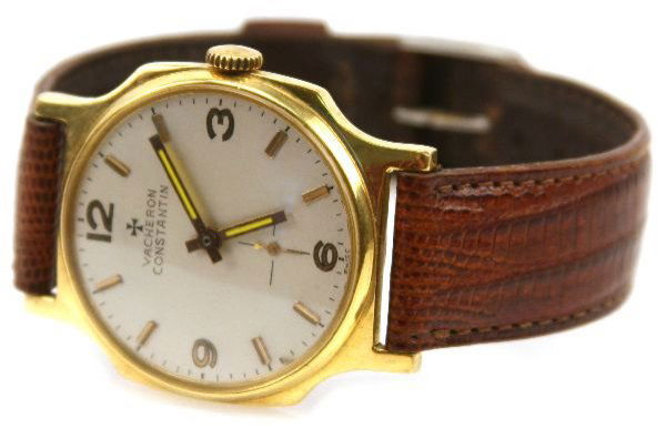VINTAGE VACHERON CONSTANTIN GOLD CLAD WATCH COPY: 35mm circular faced, octagonal watch. Gold clad bezel and stainless steel back . Slightly curved crystal. 18mm leather band.