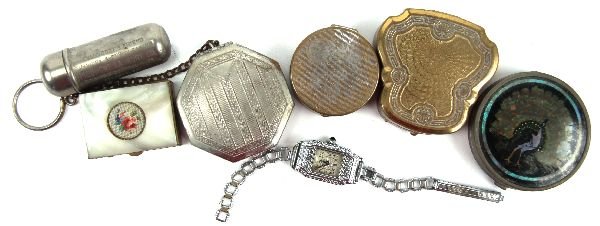 LADIES LOT OF DECO COMPACTS WATCH AND PILL BOX: A lot including four compacts from various makers such as "Karess" and "Clio", also included is a metal pill box with a needlepoint and Mother of Pearl lid and an advertising sewing kit for "Piedmont 