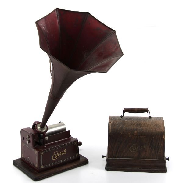 ANTIQUE EDISION FIRESIDE GEM PHONOGRAPH: Thomas Edison phonograph in red with 10x7.5 inch wooden base. Piece is in good condition with original parts and finish. Does not work, in need of service.