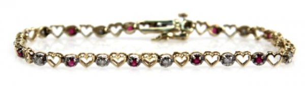 14K GOLD HEART BRACELET WITH DIAMONDS AND SPINELS: A lovely bracelet with hearts, 12 diamonds and 11 spinels. Total weight is 5.3 g