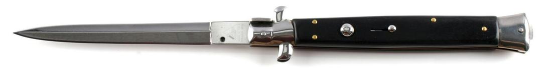 13 INCH ITALIAN MADE AKC BLACK HANDLE SWITCH BLADE: AKC Italian Made Switchblade 13 inches overall opened. Blade is made of stainless steel. Drop point blade. Very good condition.