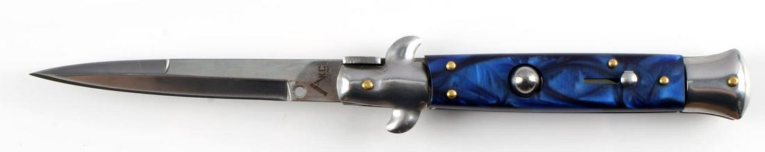 9 INCH AKC ITALIAN MADE SWITCHBLADE KNIFE: AKC Italian made switchblade. 9 inches open. Blue swirl handle. Stainless steel blade. Very good condition.