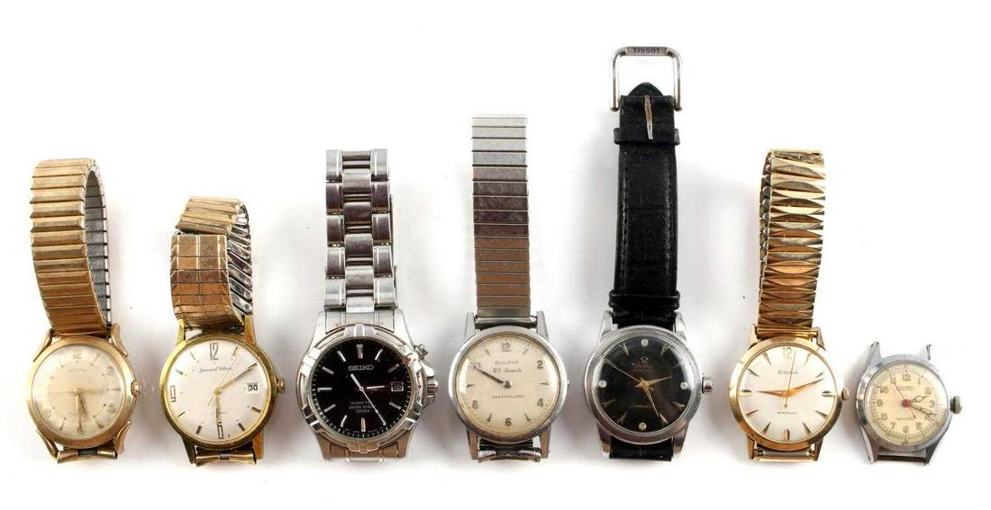 LOT OF 7 OMEGA SEIKO BULOVA GOLD WRIST WATCHES: Variety of Bulova, Hamilton, Omega, Seiko, and Colomby wrist watches. Watches are in varying condition. All feature scratching and dirt. Most run and hold time. Measurement of bezels range 28.08mm - 3