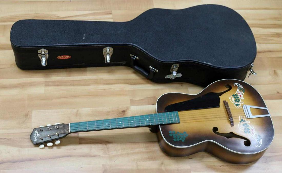 VINTAGE DEL ORO ARCH TOP GUITAR LUCKY 7 GAMBLING: Vintage Kay Del Oro guitar "Lucky 7's" for a gambling theme. Good playable condition. Paint features a horseshoe, four leaf clovers, and dice. Minor scratching throughout body. Guitar has been restore