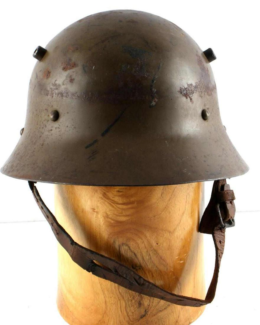 SPANISH CIVIL WAR CZECH M30 STEEL HELMET: Czech M30 helmet, circa 1930-1933. Original factory paint, liner, and chinstrap. Primarily exported by Czechoslovakia to Spain during the Spanish Civil War (1936-1939) and used Republican Forces. Fair