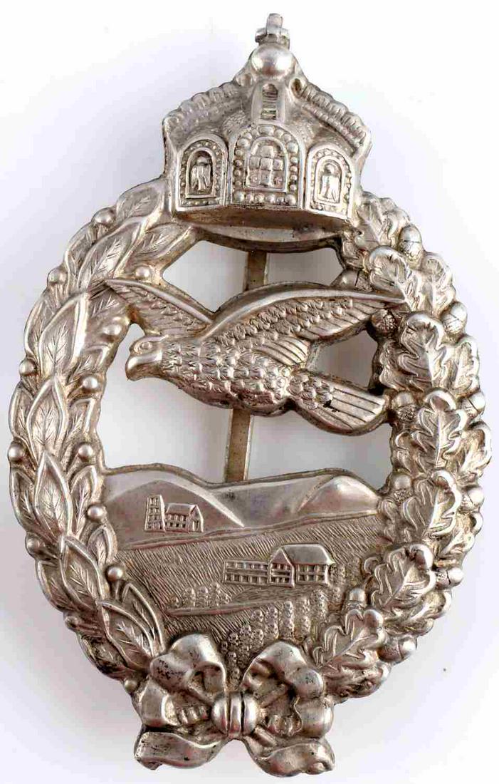 WWI PRUSSIAN COMMEMORATIVE FLYING BADGE: WWI Prussian Commemorative Flying Badge. Stamped construction with backplate attached. Pin marked W. Measures 2 7/8 inches. Good condition. This lot has a reserve.
