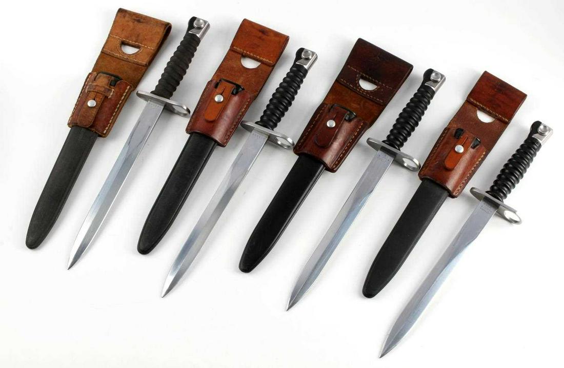 SWISS STURMGEWEHR M57 BAYONET DAGGER W FROG LOT: Group of 4 Swiss M57 daggers with Victoria Schwyz and serial number marked to ricasso, FW emblem to other side, two marked with W and serial number, FW to other side, 9.5 inch blade, comes with plasti