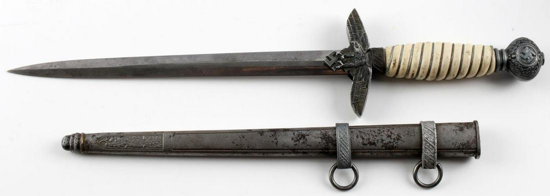WWII GERMAN THIRD REICH LUFTWAFFE OFFICER DAGGER: WWII Third Reich Luftwaffe Officer dagger. Eickhorn blade with some spotting, bakelite grip, pebble scabbard with one replaced belt loop. Minor play in Luftwaffe eagle. Measures 15 3/8 inches. Good co