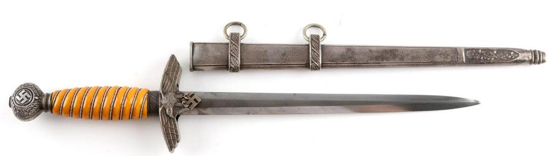 WWII GERMAN THIRD REICH LUFTWAFFE 2ND MODEL DAGGER: Third Reich Luftwaffe 2nd model dagger. Features cellulose grip with pebble scabbard and crossguard. Blade reverse is marked Eickhorn. Dent and rust free. Good condition. Measures 15 1/2 inches. This 