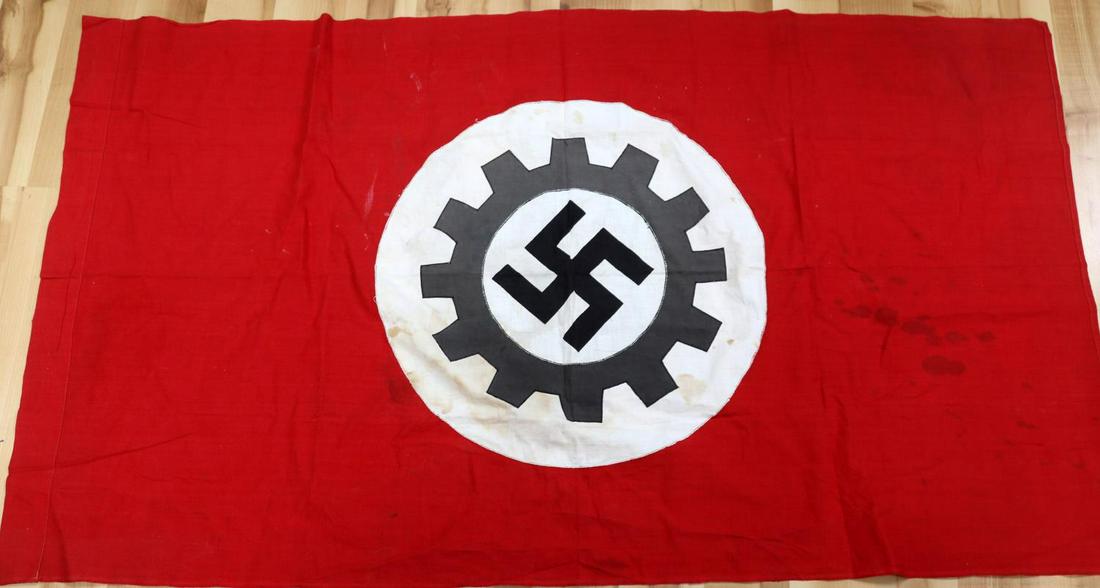WWII GERMAN DEUTSCHE ARBEITSFRONT STITCHED FLAG: WWII German Reich Deutsche ArbeitsFront stitched flag measuring 51 1/8 inches wide by 29 inches long. Center design has been stitched, not printed. Does not fluoresce. In good condition, no tears or h