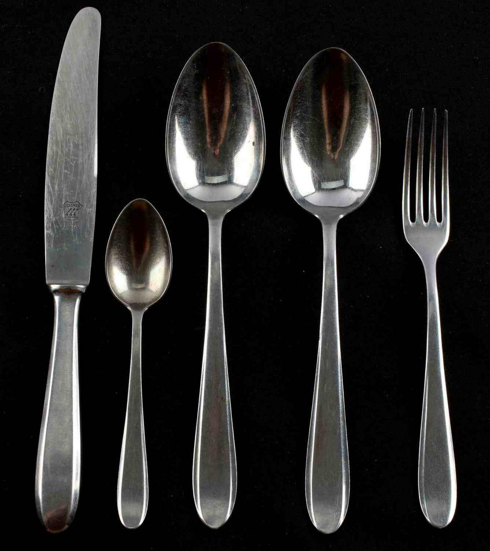 WWII GERMAN REICH WELLO & WELLNER FLATWARE SET: WWII German Reich flatware set made by Wello & Wellner to include spreading knife, two large spoons, a smaller spoon, and a fork. All are marked "Wello" and feature a reichsadler at the bottom. Blade 