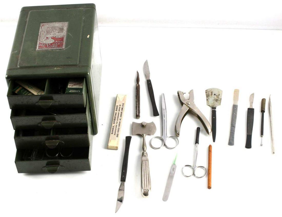 VINTAGE FILE AWAY MINI MEDICAL CHEST WITH TOOLS: Metal 4-drawer chest with assorted surgical tools, including scissors, pliers, leads, tweezers, and more. See photos. Different makers. Chest measures 8 X 5.75 X 6.25 inches. Good condition.