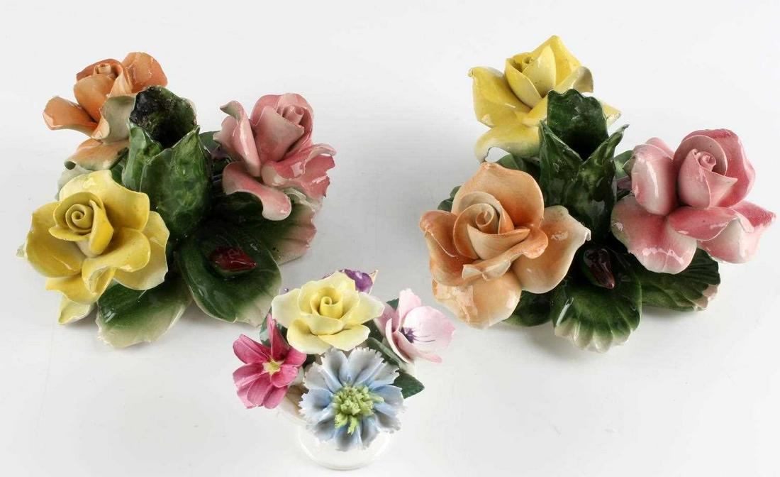 VINTAGE CAPODIMONTE FLOWER CANDLE HOLDER SET: 2 Capodimonte flower candlestick holders (6 X 4 inches), plus one Crown Staffordshire bone china flower centerpiece (4 X 3.75 inches.) Some edge chips present. Overall good condition. All pieces maker