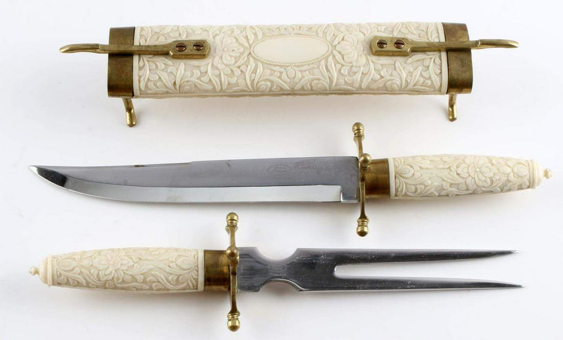 JAPANESE STAINLESS STEEL MEAT CARVING SET: Japanese stainless steel meat carving set including a fork and knife. Fork measures 11 6/16 inches long in total, with knife measuring 12 9/16 inches in total. All together in case the set measures 18