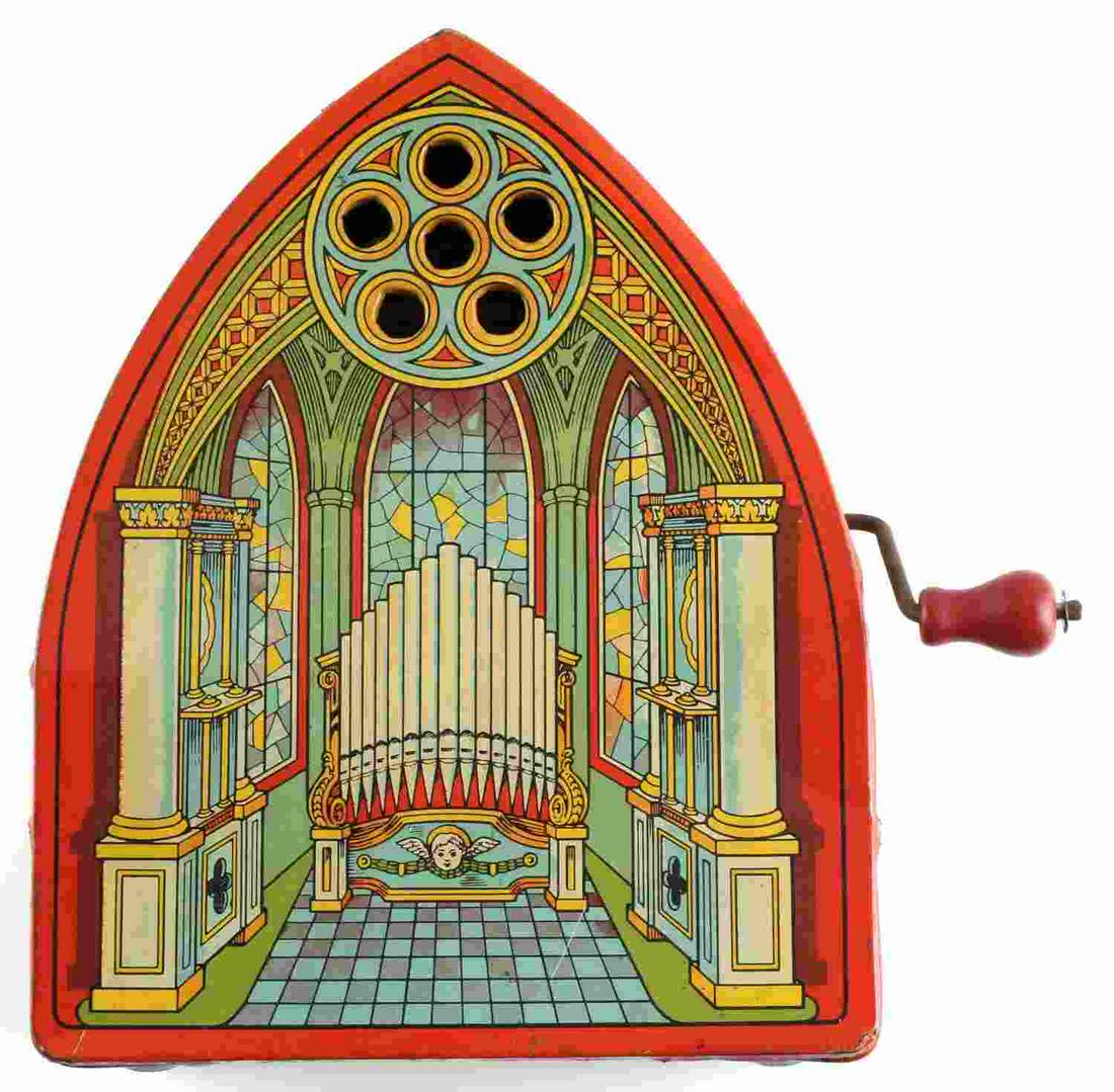 J. CHEIN AND CO HAND CRANK TIN LITHO TOY ORGAN: Circa 1950 hand crank toy music box tin toy organ. Measures 9 3/8 x 7 1/2 x 4 1/2 inches. Condition: Good working condition with minor fading and scratches, some loss along edges.