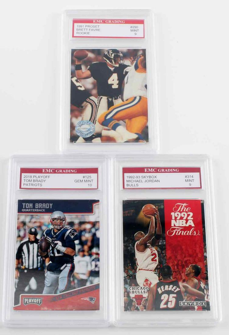 3 GRADED SPORTS CARDS BRADY JORDAN FAVRE: 3 EMC graded collectible cards. One (1) EMC graded 9 1992 Skybox #314 Michael Jordan NBA Finals card. One (1) ENC graded 10 2018 Playoff #125 Tom Brady card. One (1) 1991 Proset #290 Brett Favre rooki