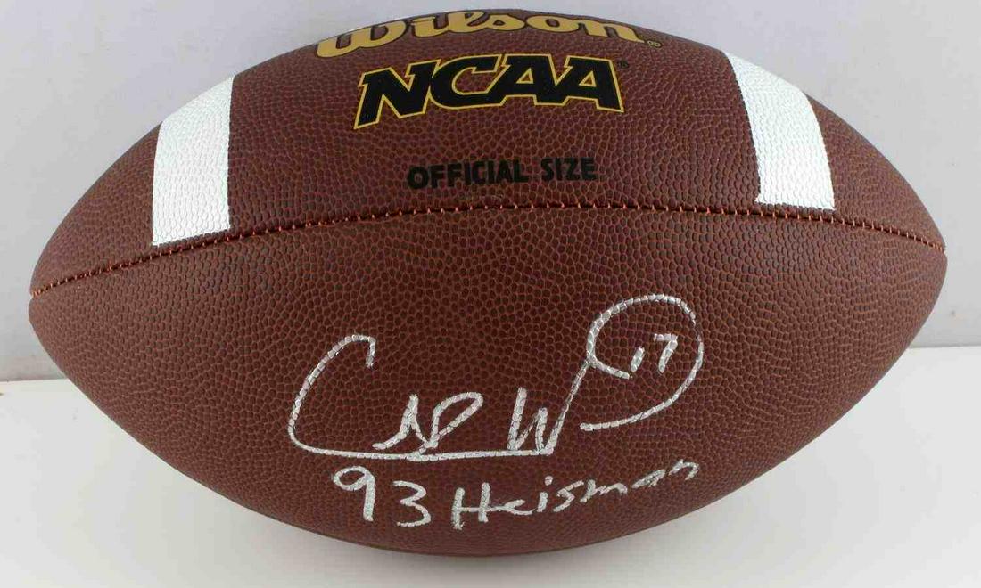 AUTOGRAPHED CHARLIE WARD FSU 93 HEISMAN FOOTBALL: Autographed Charlie Ward '93 Heisman football. Wilson NCCA official size football. "Charlie Ward 93 Heisman" signed onto the side of the football. Very fine condition. Deemed authentic according to te