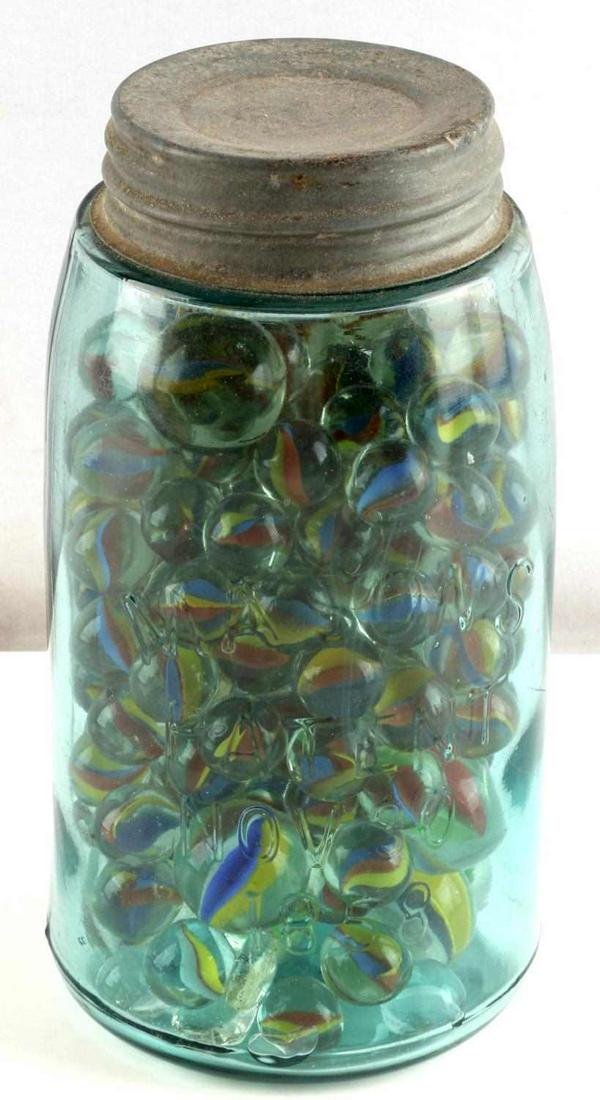 1858 PATENT MASON JAR FULL OF MARBLES UNSEARCHED: Jar measures 7 inches and is full of marbles.