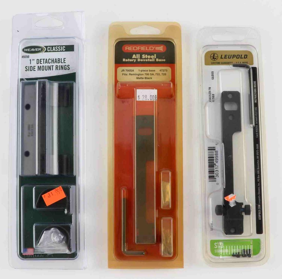 3 ASSORTED WEAVER LEUPOLD REDFIELD GUN ACCESORIES: Lot of 3 assorted Weaver, Leupold, and Redfield gun accessories. Includes one Leupold Masuer FN mount base model #49988, one Weaver classic 1 inch detachable side mount rings model #49350, and one Red