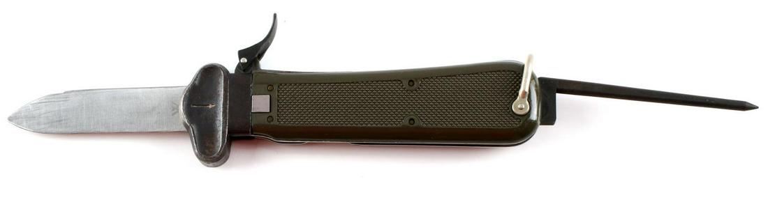 POST WWII GERMAN PARATROOPER GRAVITY KNIFE: Post WWII German paratrooper gravity knife. OD green composite grip marked BW. WMF 72 marked on blade. Measures 10 inches. Good condition.