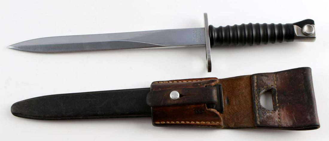 M1957 SWISS STURMGEWEHR RIFLE BAYONET W SCABBARD: M1957 Sturmgewehr 57 bayonet, scabbard & leather frog. Blade measures 9 3/8 inches long, and is marked "Victoria Schwyz" & "36723." on one side of the ricasso and has a maker's mark on the other side.