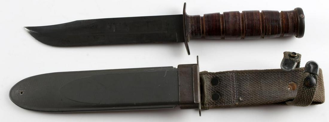US NAVY MK2 KA-BAR COMBAT KNIFE WITH SHEATH: US Navy MK2 Ka-bar combat knife with blade measuring 7 inches long marked on crossguard "KA-BAR", "USN", and "MK2". Handle, pommel, and crossguard in good condition. Sheath is marked on reverse "Nord-