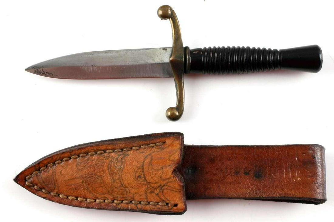 PRE WWII EUROPEAN DAGGER W LEATHER SCABBARD: Small miniature dagger with leather scabbard. Stainless steel blade with brass crossguard and black grip. Leather scabbard has interesting Chinese dragon motif. Measures 6 inches. Unmarked. Unauthenti