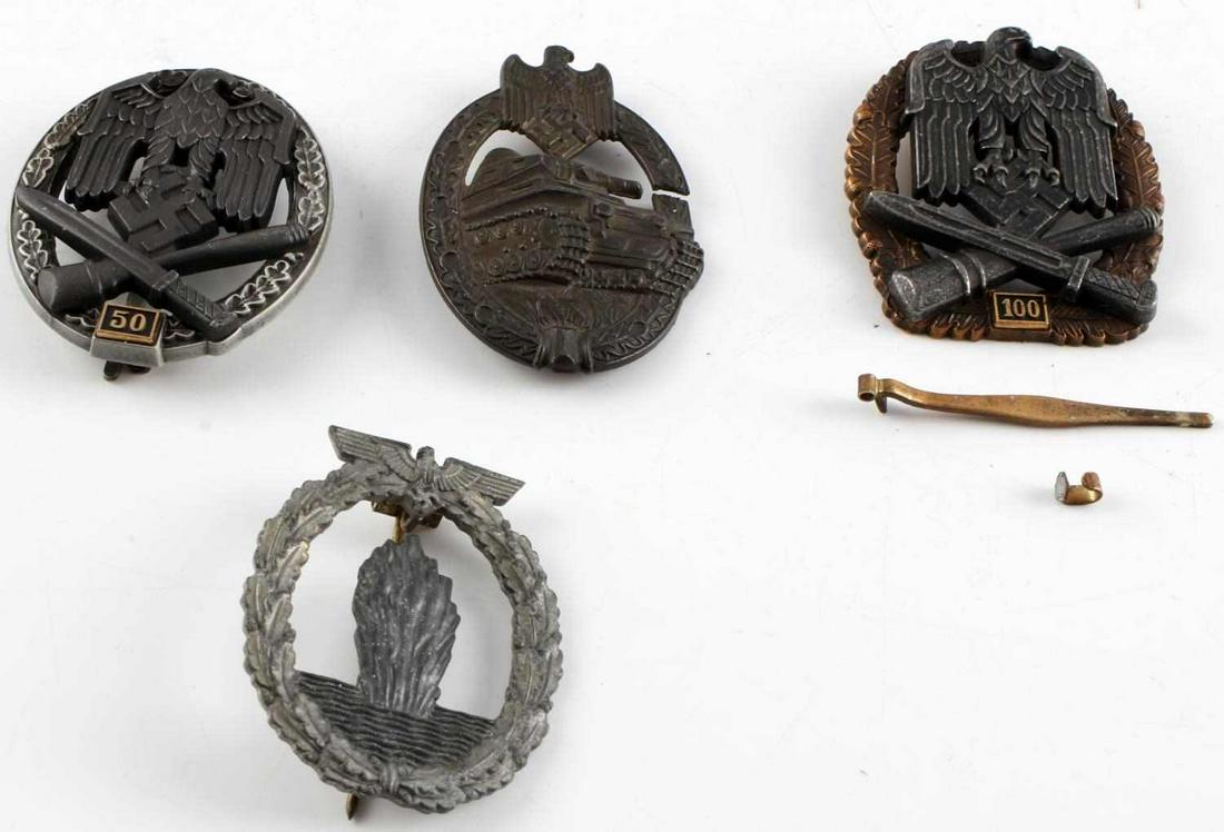 WWII GERMAN REICH LOT OF 4 BADGES COMBAT & TANK: WWII German Reich lot of 4 badges including a combat assault badge for 50 encounters and one for 100 encounters which is missing both its clasp and pin on reverse side, a panzer badge, and a Kreigsmar