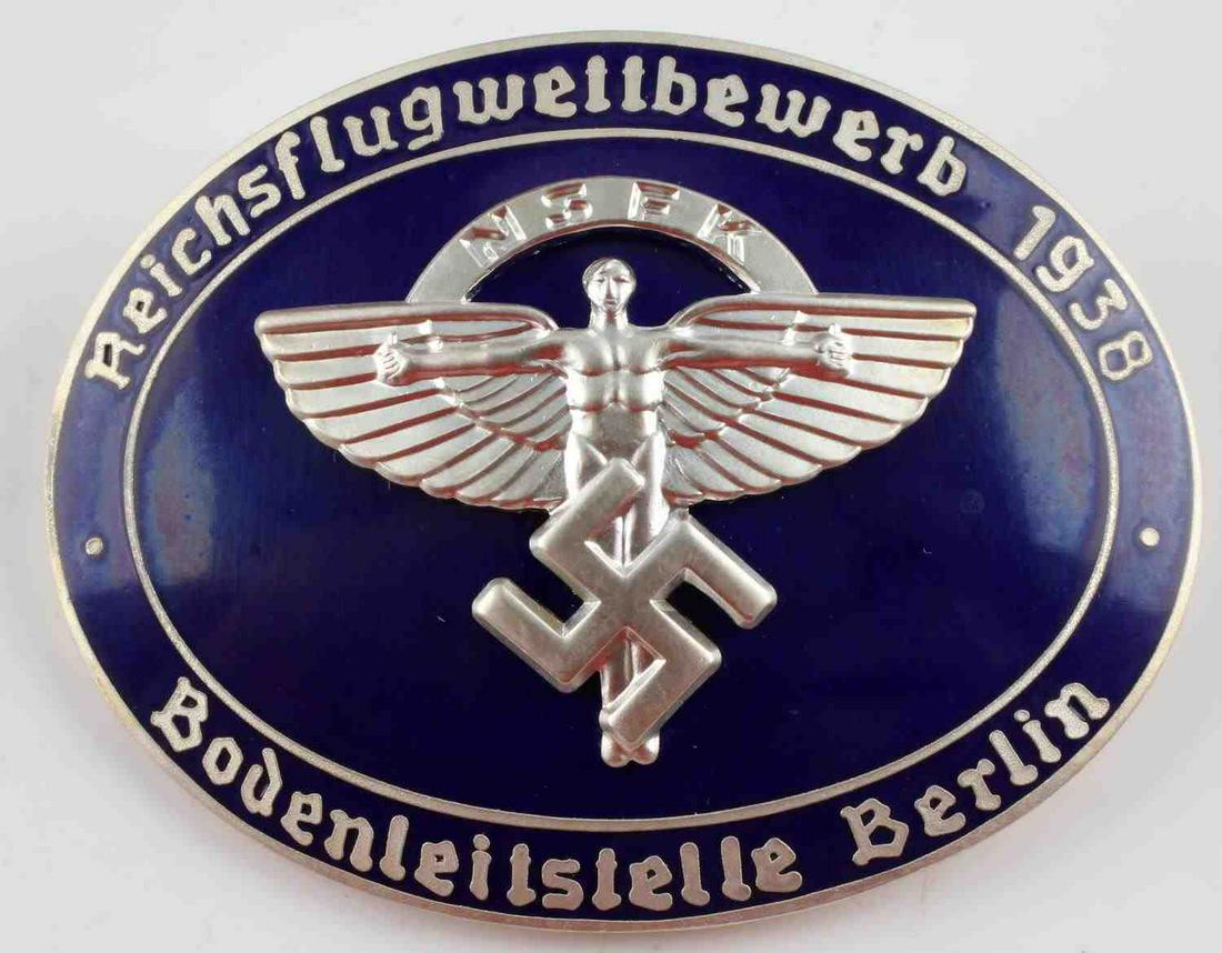 POST WWII GERMAN NSKK FLIGHT COMPETITION BADGE: Post WWII production German NSKK Flight Competition badge. Nice blue enamel atop nickel. Rob. Neff marked. Measures 2 1/4 inches. Good condition.