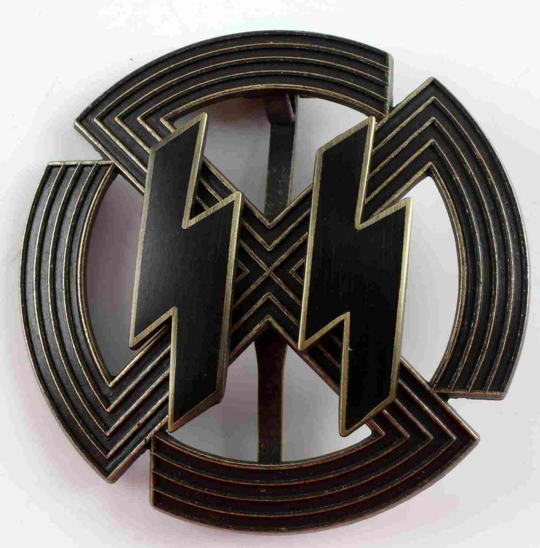 POST WWII PROD THIRD REICH SS PROFICIENCY BADGE: Post WWII production Third Reich SS proficiency badge. Black enameled SS runes. Reverse marked RZM M1/24. 2 inch diameter. Good condition.