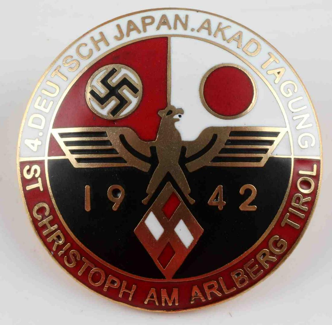 POST WWII PROD THIRD REICH GERMAN JAPAN ALLY BADGE: Post WWII production Third Reich German and Japan ally badge. Features both the Nazi Germany and Japanese flags with Parteiadler and 1942. Measures 1 1/4 Inches. Good condition.