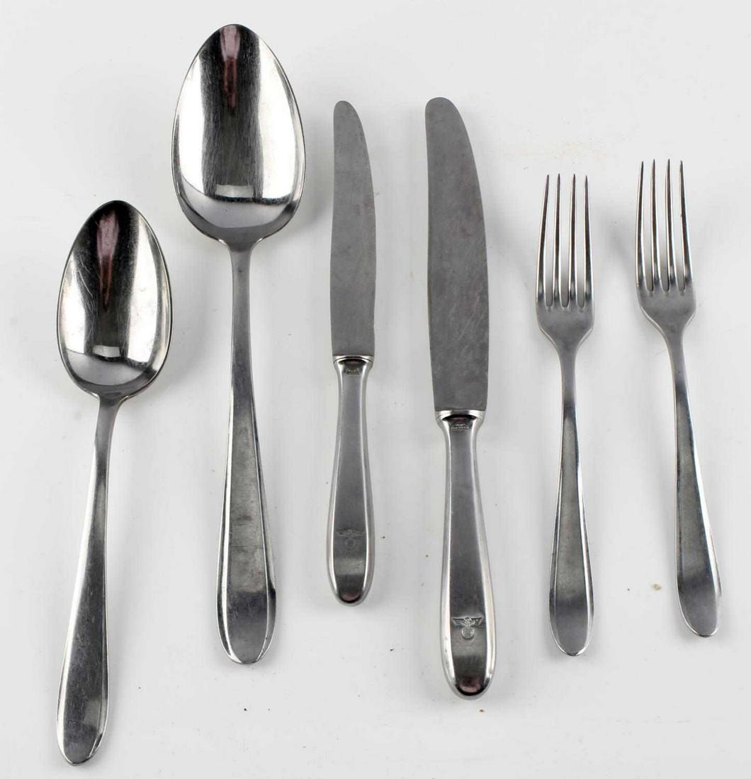 WWII GERMAN REICH WELLO & WELLNER FLATWARE: WWII German Reich Wello & Wellner Flatware to include two large spoons, two forks, and two knives. All sport reichsadler markings on the bottom, and are marked "Wello". Blades on the knives are marked