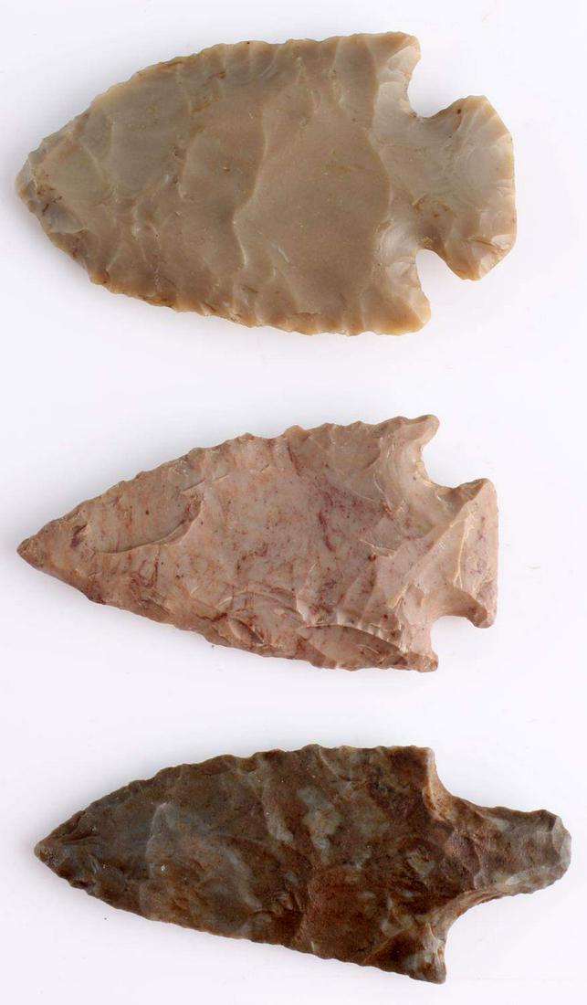LOT OF 3 NATIVE AMERICAN FOUND NOTCHED ARROWHEADS: Flint and chert made. Notched and straight stemmed. Good patination. Found in Alabama, Kentucky, and Ohio. Measure 2 1/4 inches From a private collection.