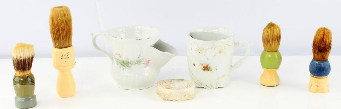 LOT OF 7 ANTIQUE VINTAGE SHAVING MUGS WITH BRUSHES: Lot includes 2 shaving mugs, 3 brushes and an unopened shaving cream bar. Nice porcelain cups with hand painted flower patterns. Comes with 3 brushes from Erskine and Century. Measurements range 3 3/4