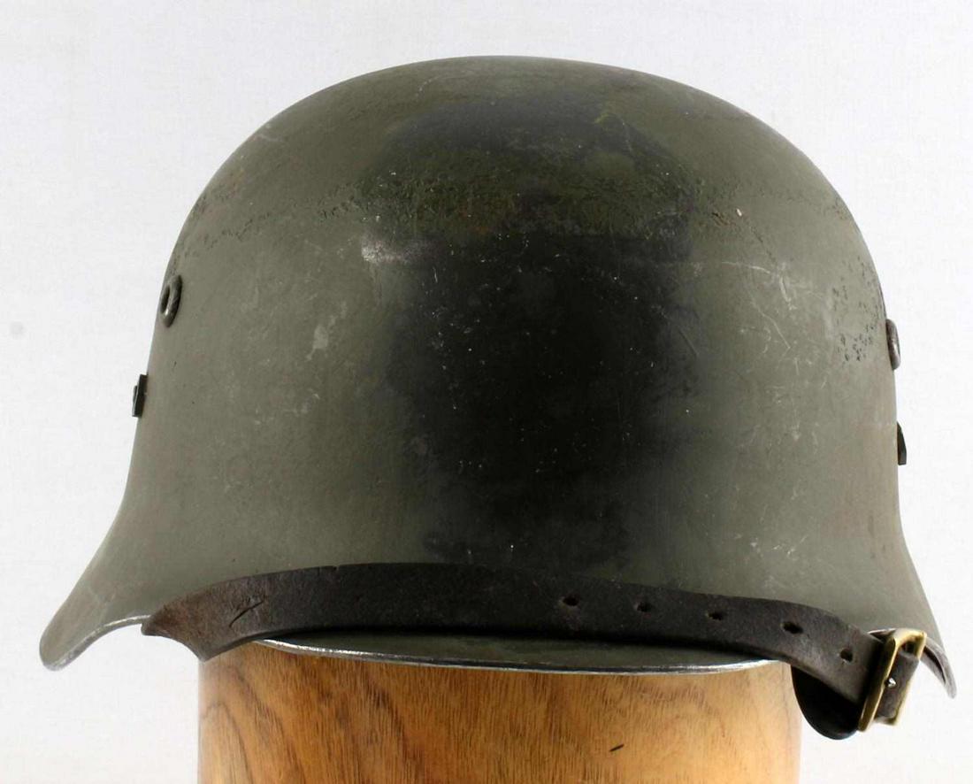 WWII RUSSIAN FRONT HUNGARIAN M38 FINNISH HELMET: Hungarian M38, circa 1940-41. Hungarian M38 helmets were supplied to Finnish forces in WWII for use against the Soviets. Painted darker green for Finnish use. Hungarian marked for Finnish export (DM62
