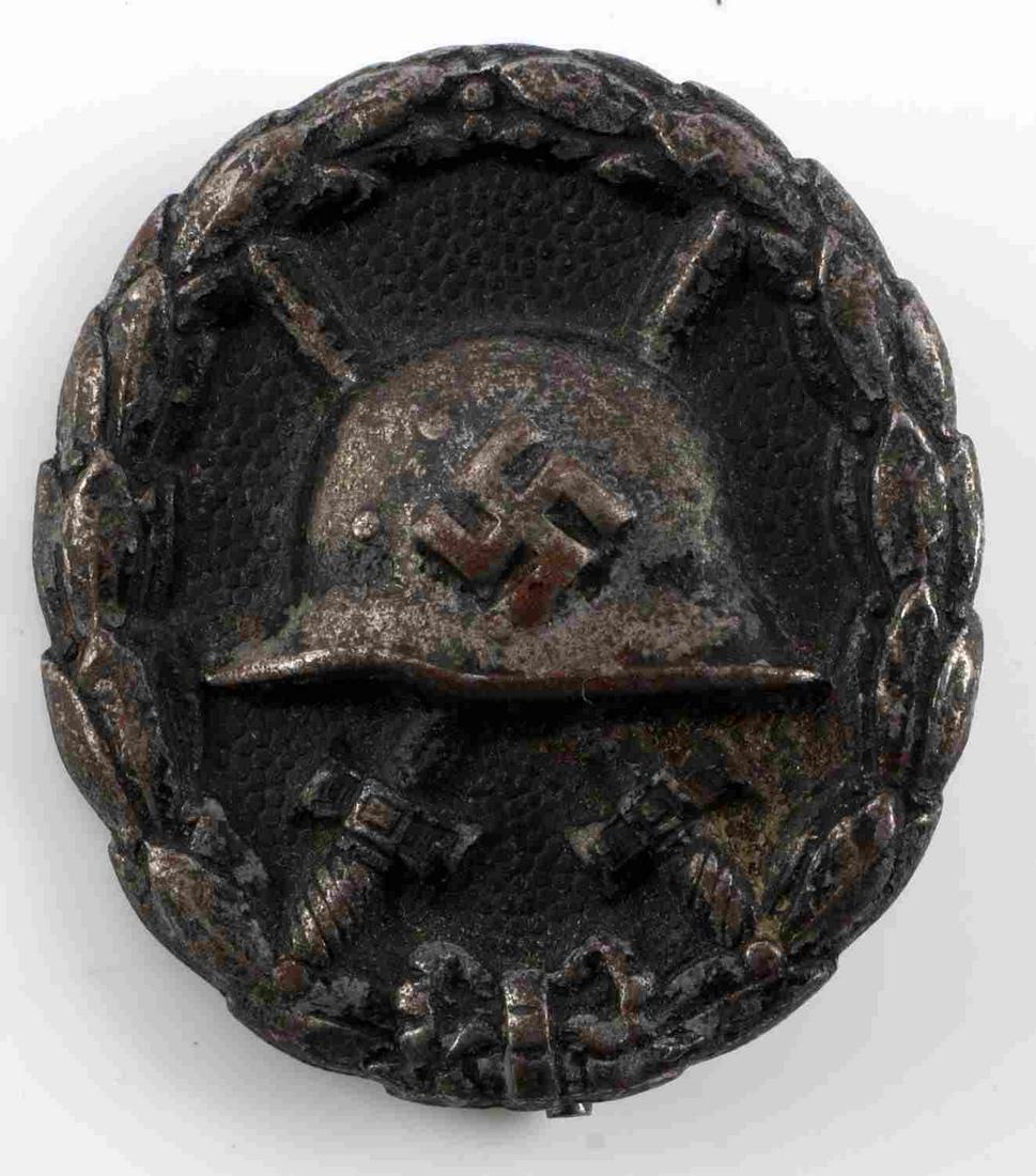WWII GERMAN REICH SPANISH CIVIL WAR WOUND BADGE: WWII German Reich Condor Legion combat wound badge from 1936 Spanish Civil War in black. Good condition, reverse side features vertical pin back.