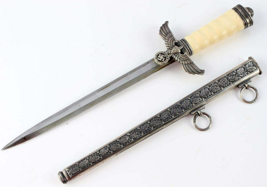 WWII GERMAN REICH GORING PRESENTATION DAGGER: WWII German Reich Hermann Goring presentation dagger reproduction with blade measuring 10 1/16 inches long and marked "Paul Weyersberg & CO. Berlin" on the ricasso. Dagger and scabbard in good conditi