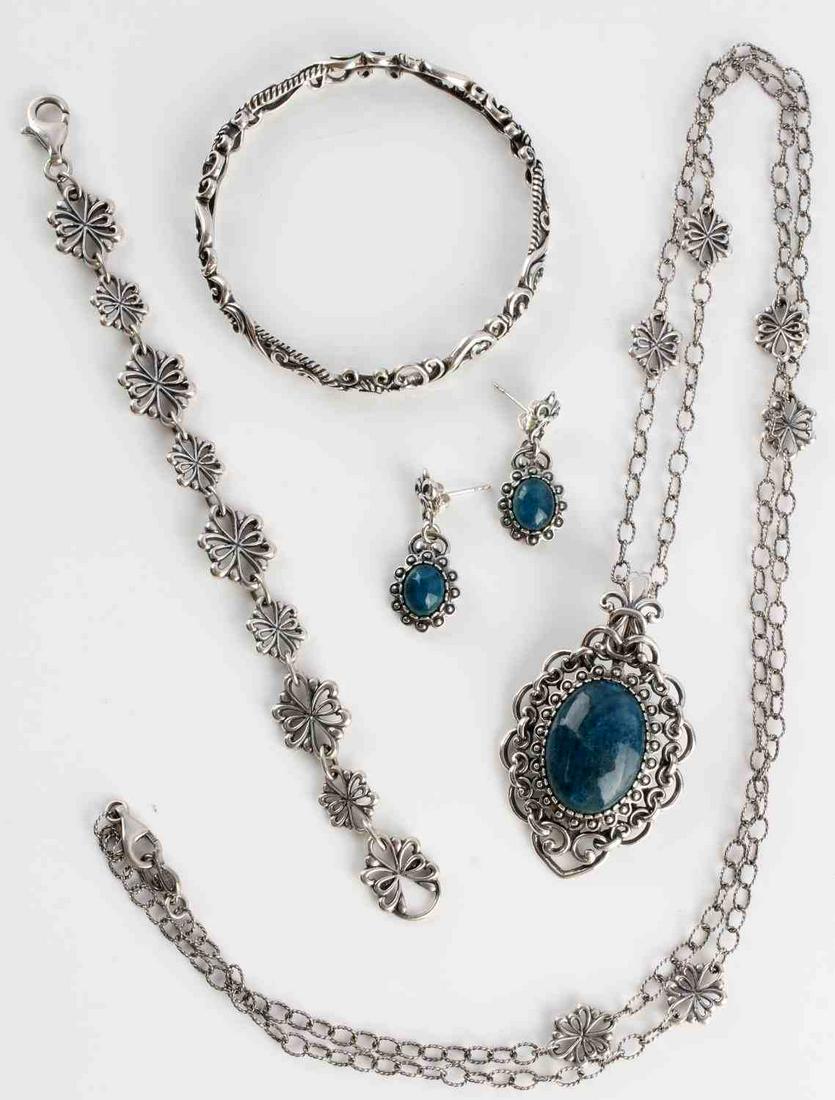 NAVAJO STERLING SILVER JEWELRY BY CAROLYN POLLACK: Pendant features a Bezel set, oval 24x17mm Green Quartzite gemstone cabochon with a sterling silver beaded frame, scrolling silver accents and a polished oxidized finish. Snap hinge bail. Pair of cabo
