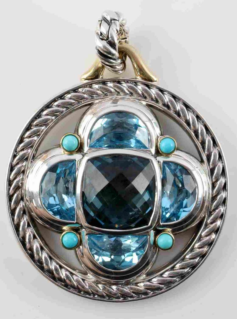 DAVID YURMAN STERLING 18K GOLD BLUE TOPAZ PENDANT: David Yurman 18k gold and sterling silver pendant with blue topaz and turquoise. Round pendant with round engraved rope surrounds 5 blue topaz stones and blue turquoise sleeping beauty stones. 18k gol
