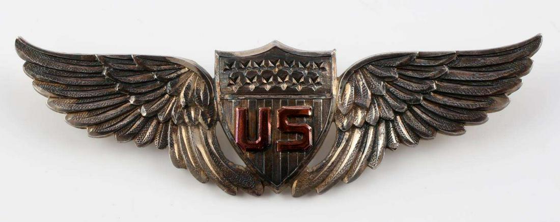WWI U.S. AIR SERVICE STERLING SILVER PILOTS WINGS: This badge is believed to have been made by J.R. Grant Co., London, England. Die struck from one piece of silver with spaces between the wings and shield. Both pin and safety catch and screw post meth