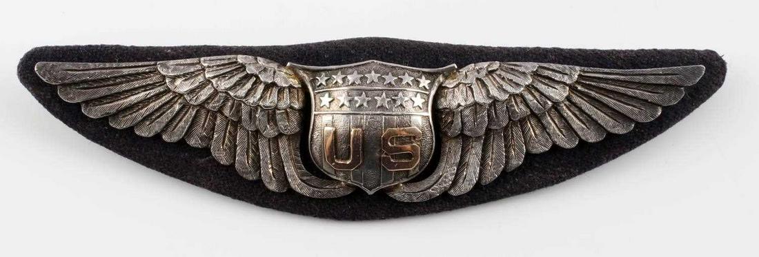WWI U.S. AIR SERVICE STERLING SILVER PILOTS WINGS: Beautiful hand-made oversized wing made by Dibb Jewelers, San Diego, California. This badge was worn by Lt. Henry Chapman. It is constructed of three separate pieces of silver, each hand chased and so