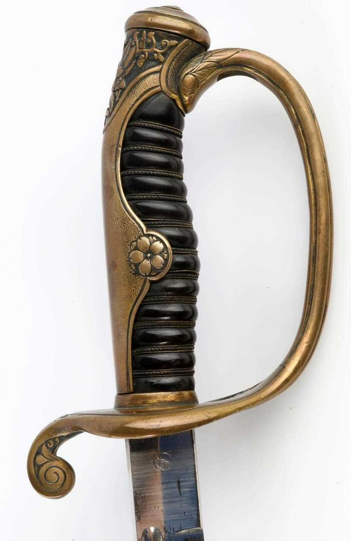 WWII JAPANESE AMERICAN ARMY DRESS SABER SWORD: WWII Japanese army dress saber. Thin katana style blade with black steel scabbard. Blade has some spotting and marked US and SS. Wood grip with brass hand guard featuring flower pattern. Altogether me