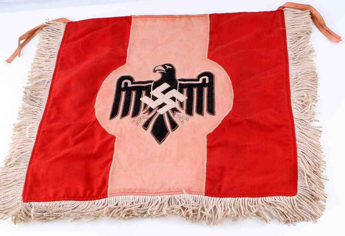 WWII GERMAN SPORTS FLAG BANNER DOUBLE SIDED: Double-sided flag with eagle and swastika at center, fringe border, and ties for hanging. Measures 20 X 18 inches. Shows some wear and color bleeding, otherwise good condition. This lot has a reserve.