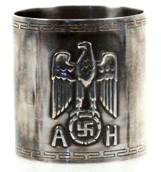 ADOLF HITLER NAPKIN RING IN GERMAN 800 SILVER: 2 by 1.75 inch conical shaped napkin ring from Hitlers residence in Obersalzberg, over Bertesgaden in the Bavarian Alps. Hallmarked by Bruckmann and carrying the assay marks of the crown, eagle and mo