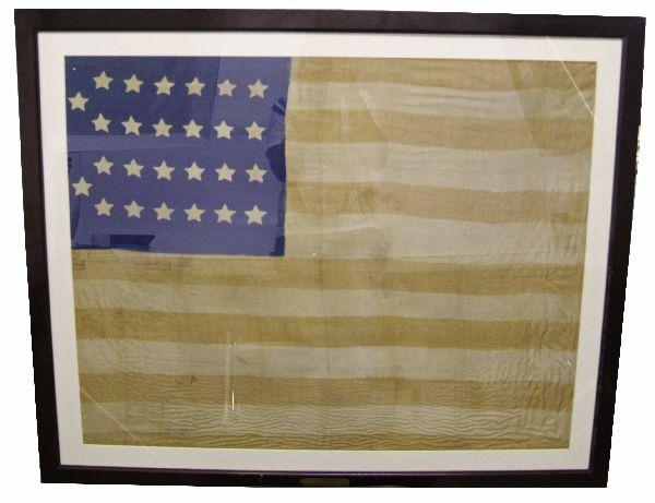 26 STAR AMERICAN FLAG PRESENTED TO USN MEDICAL DIR: A linen 43x23 framed 26 star (1837-1849) American flag, dyed not sewn, presented to the Medical Director of the USN Isaac Brinckerhuff. Very good condition with minimal detractions.