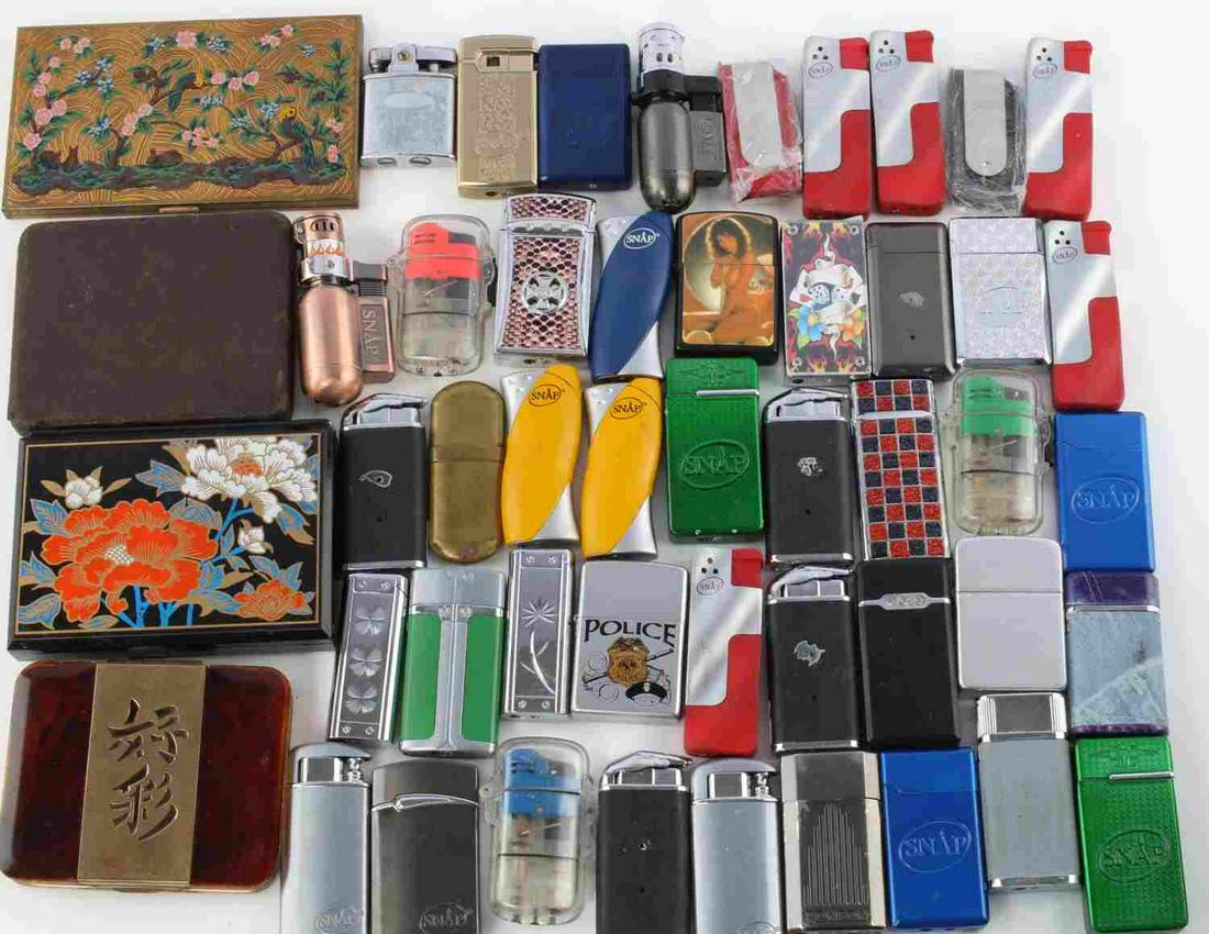 MIX LOT OF 45 LIGHTERS 3 CIGARETTE CASES COMPACT: Lot of varying colors and sizes, brands include Snap Ronson, Zippo, and more. Includes 3 cigarette cases and 1 compact. All good condition