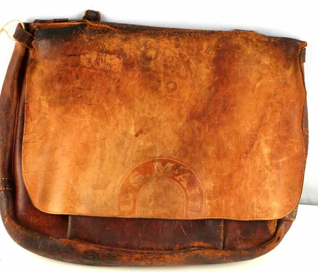 VINTAGE BONA ALLEN LEATHER U.S MAIL MESSENGER BAG: U.S. Mail messenger bag by Bona Allen. Leather construction. Minimal stiffness. Dated 1957. Features cracking and tearing. Measures 15 x 19 inches.