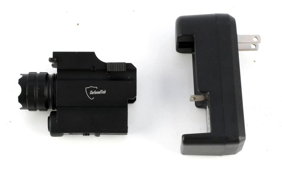 DEFENDTEK RECHARGABLE RAIL MOUNTED LASER SIGHT: DefendTek DT-M3 rechargeable rail mounted laser sight. Gun flashlight with quick release 5mW 532nm laser. Box has been opened but sight is in very fine condition with charger, battery and tool include