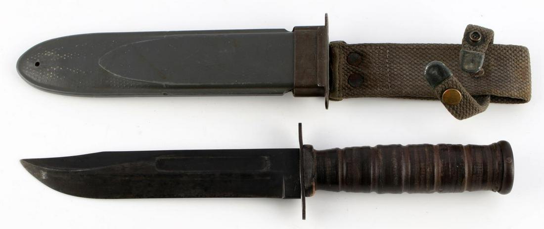 WWII USN MARK 2 MILITARY FIGHTING KNIFE KA BAR: Nice WWII era United States Navy Mark 2 Camillus military fighting knife with scabbard. Crossguard marked Camillus US N.Y. U.S.N MARK 2. Measures 12 inches overall. Good condition.