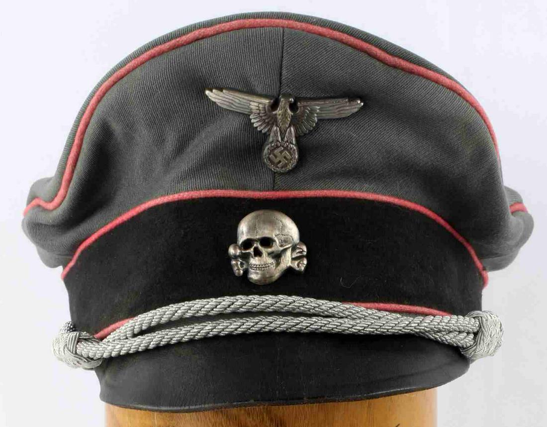 WWII GERMAN THIRD REICH SS PANZER TOTENKOPF VISOR: Third Reich SS Panzer style visor hat. Pink piping, olive fabric. Interior marked Fischer & Dreischer with insignia. Possible leather sweatband around interior with lining torn at 6 points. Silver bul